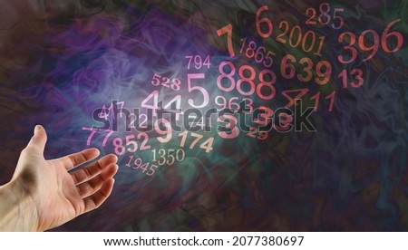 Be guided by Numerology - open palm gesturing towards a flow of random number including Solfeggio and significant historical dates on a dark flowing ethereal background with copy space
