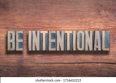 be intentional phrase combined on vintage varnished wooden surface - Shutterstock ID 1716652213