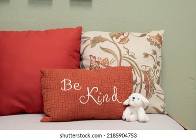 Be Kind Statement On A Bench With A Plush Animal. School Office Interior.