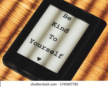 Be Kind To Yourself Message On Ebook Reader