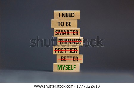 Be myself symbol. Businessman hand. Wooden blocks with words 'i need to be myself, not smarter, thinner, prettier, better'. Beautiful grey background, copy space. Psychological, be myself concept.