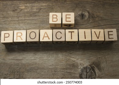 be proactive text on a wooden background