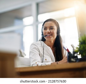 Be productive in helping customers. Shot of a female agent working in a call centre. - Shutterstock ID 2128757630