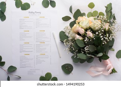 Be Ready For Wedding Troubles. Bridal Roses Bouquet And Planning Checklist On White Background