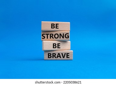 Be Strong Be Brave Symbol. Concept Words Be Strong Be Brave On Wooden Blocks. Beautiful Blue Background. Business Concept. Copy Space.