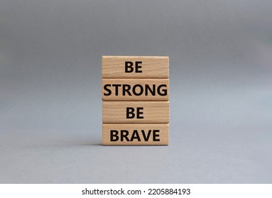 Be Strong Be Brave Symbol. Concept Words Be Strong Be Brave On Wooden Blocks. Beautiful Grey Background. Business Concept. Copy Space.