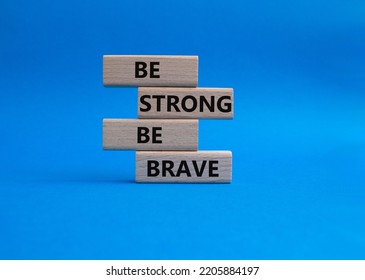 Be Strong Be Brave Symbol. Concept Words Be Strong Be Brave On Wooden Blocks. Beautiful Blue Background. Business Concept. Copy Space.