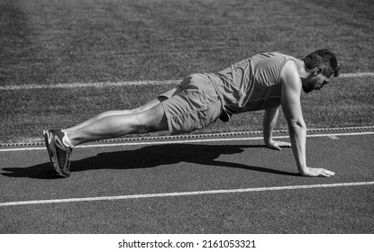 Be strong. man in plank. sports and healthy lifestyle routine. sport success. male athlete do morning exercise. pushups workout. sportsman planking outdoor. health care. muscular guy do sport
