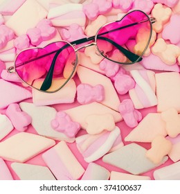 Be Vanilla. Sunglasses Heart and Candy background.