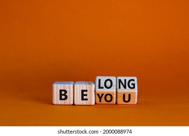 Be you, belong symbol. Turned cubes and changed words 'be you' to 'belong'. Beautiful orange background. Business, belonging and be you, belong concept. Copy space. - Shutterstock ID 2000088974