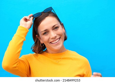 Be Your Beautiful Authentic Self. Cropped Portrait Of A Happy Young Woman Posing Against A Blue Background.