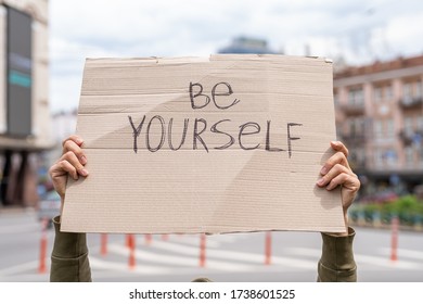 Be Yourself Support Phrase For Body Positive Movement. Self-respect And Self Love Support.  Hands Holding Banner Outside On City Streets. Social Care Motivation Concept. Friendly Mood Attitude.