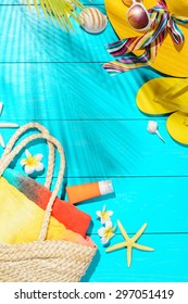 beach accessories on the blue wooden board - Shutterstock ID 297051419