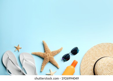 Beach Accessories On Light Blue Background, Flat Lay. Space For Text