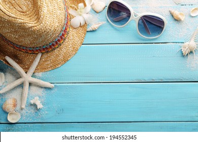 beach accessories on wooden board