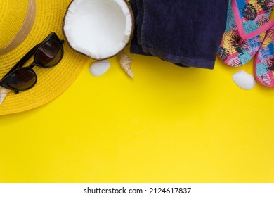 Beach accessories on yellow background. Top view with copy space - Shutterstock ID 2124617837