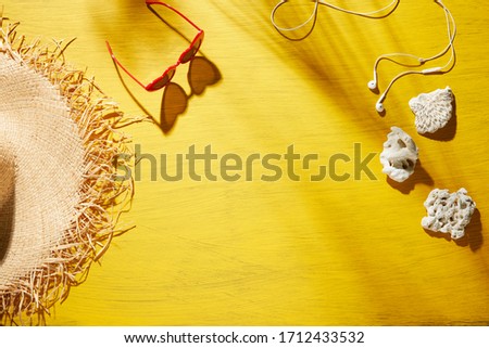 Beach accessories for women on a yellow background - summer holiday
