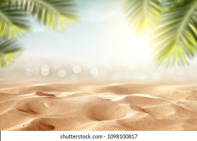 Beach background with sand and palm decoration. Summer photo of free space for your decoration. 
