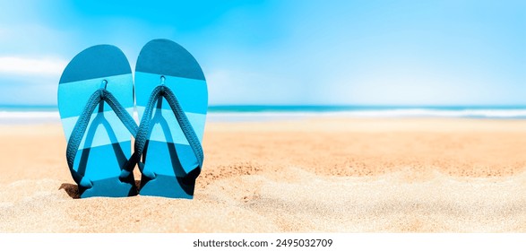 Beach backgrounds - Flip-flops on tropical beach sand - Summer vacations travel concept - Copy space.