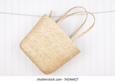 Beach Bag On A Clothesline Hanging For A Summer Scene.