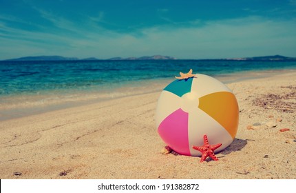 Beach Ball By A Turquoise Shore In Vintage Tone