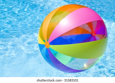 Beach Ball Floating In Swimming Pool