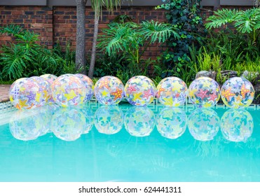 Beach Balls Floating On Water In Home Swimming Pool Party Decor