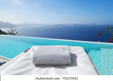 Beach Bed Chair With Towel Looking Out Over The Caldera By The Swimming Pool , Santorini Oia