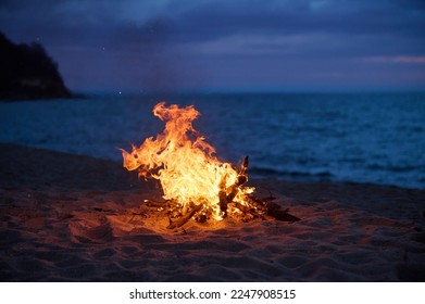 Beach Bonfire selective focus with Beautiful Sunset or sunrise no people