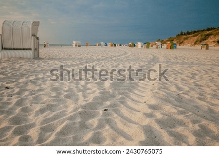 Beach cabins on the sea coast of the northern sea. Vacation on the North Sea. Beaches of the Frisian Islands in Germany. Sea summer mood. 