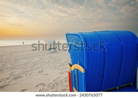  Beach cabins on white sand.Sea summer mood. Vacation on the North Sea. Beaches of the Frisian Islands in Germany. 