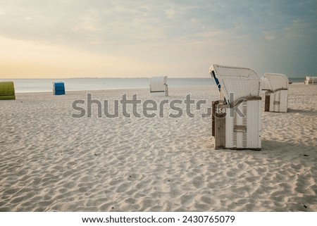 Beach cabins on white sand. Vacation on the North Sea. Beaches of the Frisian Islands in Germany. Sea summer mood. 