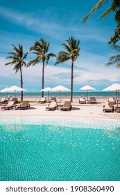 Beach Chair Around Swimming Pool In Hotel Resort With Sea Beach Background - Holiday And Vacation Concept