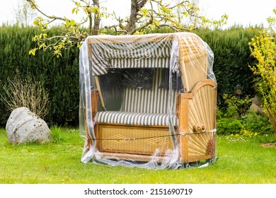 Beach Chair In A Private Garden, Protected From Bad Weather By Foil