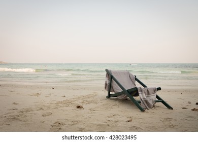 Beach Chair With Shawl Sit On Sea View. Tone And Vignette.
