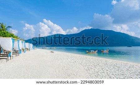 beach chairs at the beach of Koh Kradan island in Thailand on a sunny day on the beach