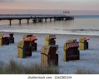 Beach Chairs On The Beach At Dusk, The Pier At The Back, Bay Of Lübeck, Baltic Sea, Scharbeutz, Schleswig-Holstein, Germany