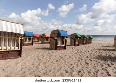 Beach chairs on Timmendorfer Strand on the Baltic sea with blue sky. Germany - Shutterstock ID 2339611411
