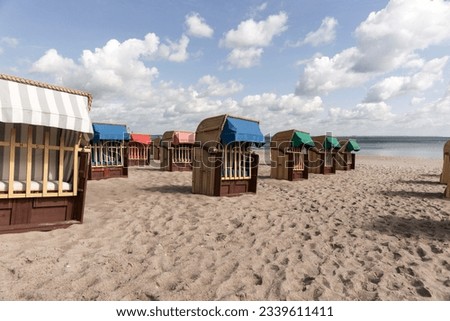 Beach chairs on Timmendorfer Strand on the Baltic sea with blue sky. Germany