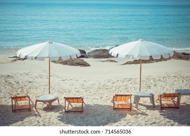 Beach Chairs And Umberella On Tropical Ocean Beach