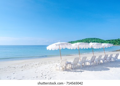 Beach Chairs And Umberella On Tropical Ocean Beach