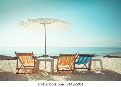 Beach Chairs And Umberella On Tropical Ocean Beach