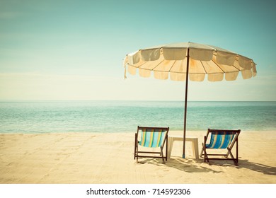 Beach Chairs And Umberella On Tropical Ocean Beach