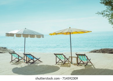 Beach Chairs And Umberella On Tropical Ocean Beach