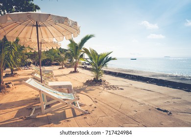 Beach Chairs And Umberella On Tropical Ocean Beach