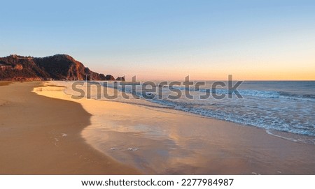 Beach of Cleopatra with sea and rocks of Alanya peninsula - Antalya, Turkey 