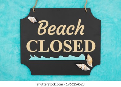 Beach Closed Word Message On Hanging Chalkboard Sign With Seashells