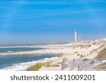 The beach of  Costa Nova do Prado at Aveiro, and the Lighthouse of Praia da Barra on the Atlantico coast of Portugal