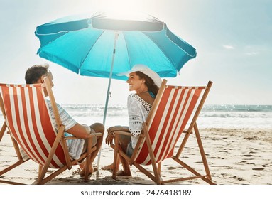 Beach, couple and relax chair for vacation adventure, bonding and love together in summer sunshine. Smile, woman and man with care, support and tropical holiday travel for ocean journey in Greece - Powered by Shutterstock
