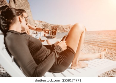 Beach Couple Relaxing on Lounger, Summer Vacation, Sea Coast - Powered by Shutterstock